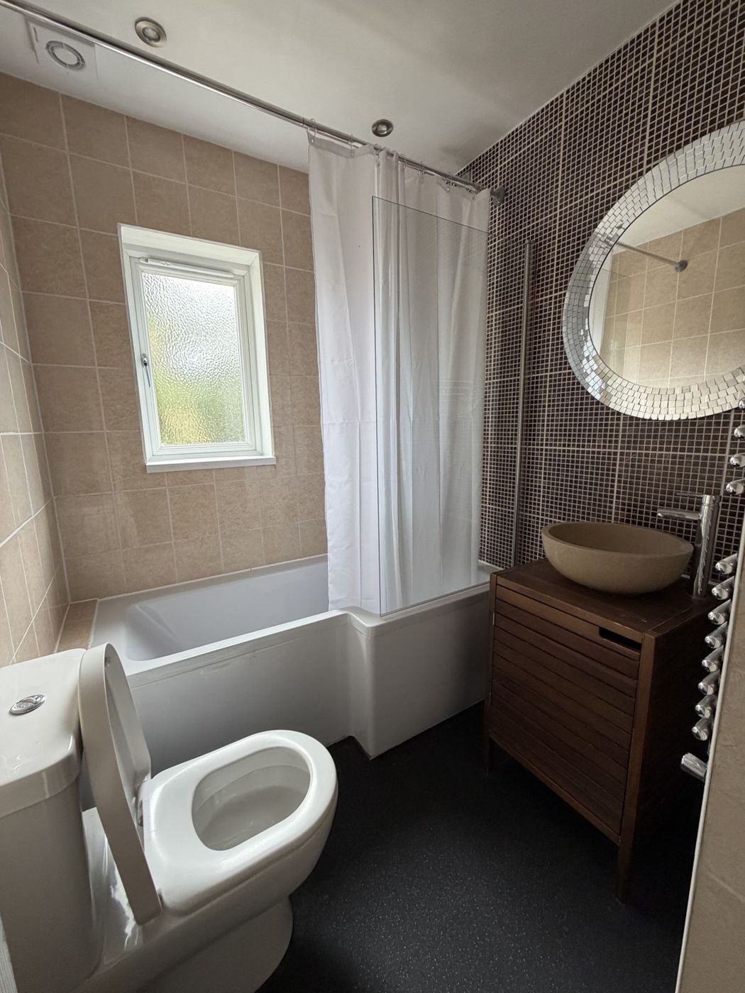 Bathroom with bath and over-bath shower