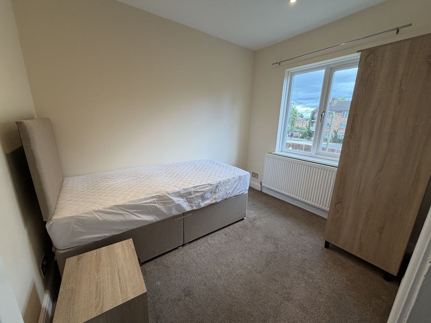 Single bedroom with wardrobe and window
