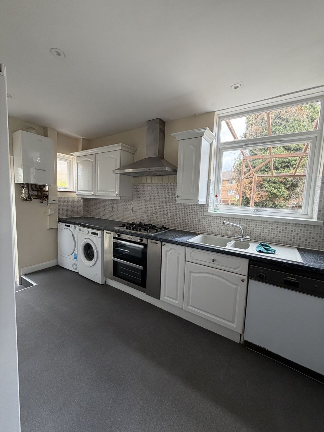 Kitchen with oven, hob, washer, dryer and dishwasher